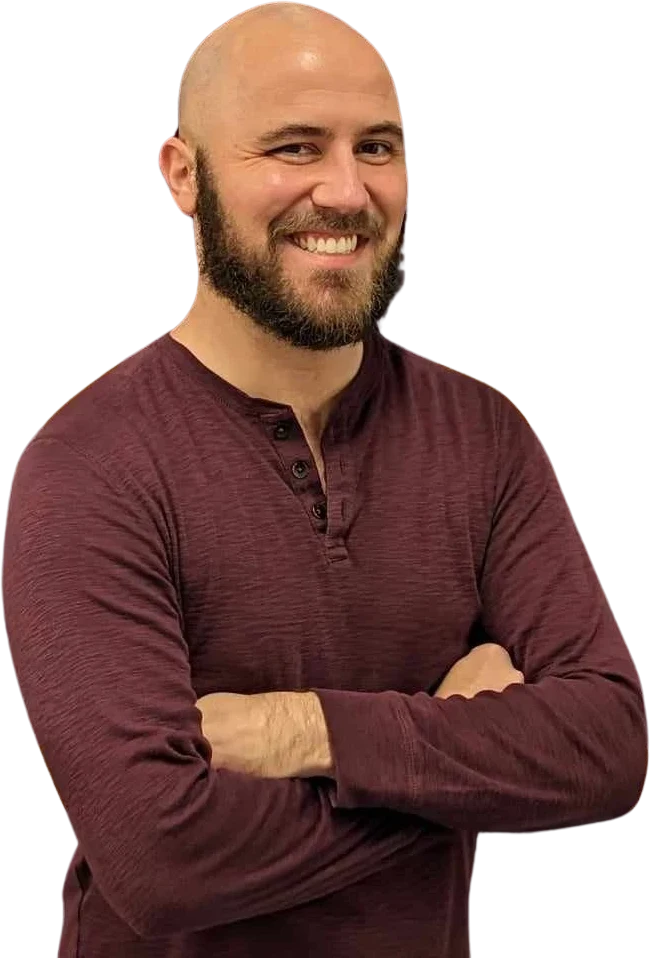 Kurt Wirth, host of Very Hard Trivia, smiling with arms crossed